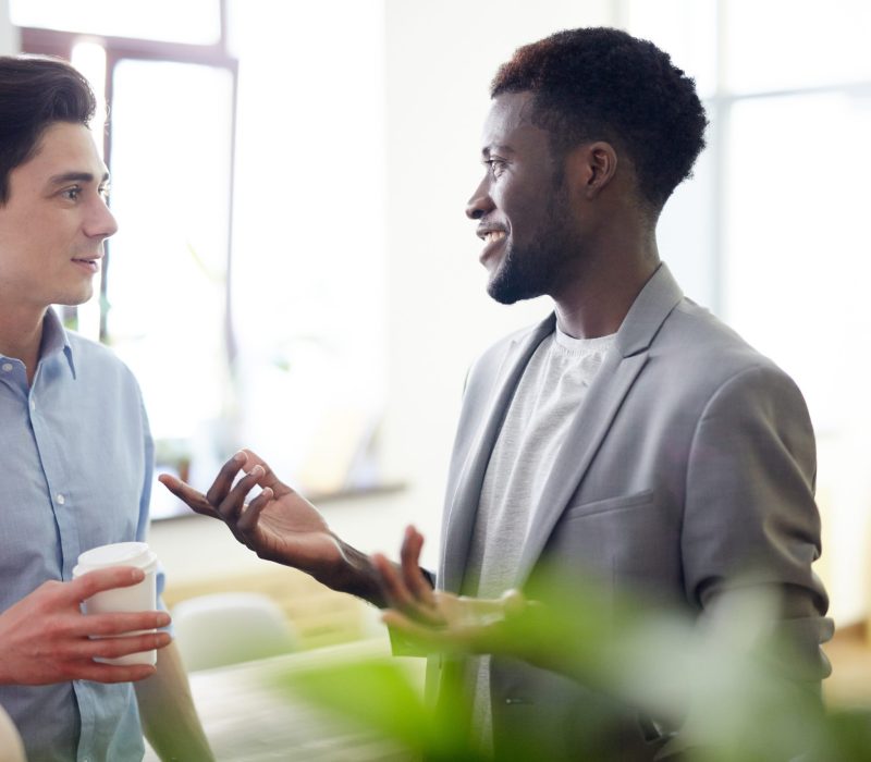 Group of employees having discussion in office